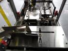 Used Bivans 54L Carton Former and Bottom Closer. Capable of speeds up to 60 cartons per minute. Has a carton size range: (Length) 1/2