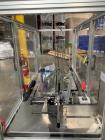 Used: Bivans Model 54L Semi Automatic Vertical Cartoner (carton former and bottom sealer). Capable of speeds up to 60 cartons per minute. Has a carton size range: 7/8