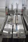 Used Bivans 54L Carton Former and Bottom Closer. Capable of speeds up to 60 cartons per minute. Has a carton size range:  1/2
