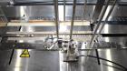 Used Bivans 54L Carton Former and Bottom Closer. Capable of speeds up to 60 cartons per minute. Has a carton size range:  1/2