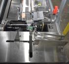 Used Bivans 54L Carton Former and Bottom Closer. Capable of speeds up to 60 cartons per minute. Has a carton size range:  1/2