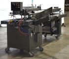 Used Bivans Vertuck Model 74 Semi Automatic Vertical Cartoner. Capable of speeds up to 120 CPM. Has 6