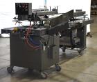 Used- Bivans Vertuck Model 74 Semi Automatic Vertical Cartoner. Capable of speeds up to 120 CPM. Has 6