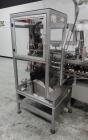 Used- CAM Model AV Vertical Cartoner With Automatic Bottle Loader