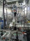 Used-Cariba Model C230 Automatic intermittant motion vertical cartoner with robotic loader for bottles/jars. Capable of spee...