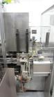 Used Jones CMV-5 Semi- Automatic Vertical Cartoner with bottle loader