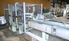 Used Jones Model CMV5 Semi-Automatic Tuck Vertical Cartoner. Machine is capable of speeds up to 120 cartons per minute. Has manual load station of 8' (both sides). Has 5