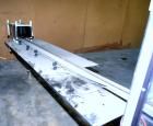 Used Jones Model CMV5 Semi-Automatic Tuck Vertical Cartoner. Machine is capable of speeds up to 120 cartons per minute. Has manual load station of 8' (both sides). Has 5