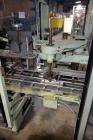 Used Jones Model CMV5 Semi-Automatic Tuck Vertical Cartoner. Machine is capable of speeds up to 120 cartons per minute. Has manual load station of 8' (both sides). Has 5