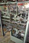 Used Jones Model CMV5 Semi-Automatic Tuck Vertical Cartoner. Machine is capable of speeds up to 120 cartons per minute. Has manual load station of 8' (both sides). Has 5