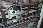 Used Jones Model CMV5 Semi-Automatic Tuck Vertical Cartoner. Machine is capable of speeds up to 120 cartons per minute. Has manual load station of 8' (both sides). Has 5