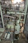 Used Jones Model CMV5 Semi-Automatic Tuck Vertical Cartoner. Machine is capable of speeds up to 120 cartons per minute. Has manual load station of 8' (both sides). Has 5