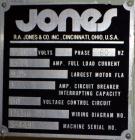 Used Jones Model CMV5 Semi-Automatic Tuck Vertical Cartoner. Machine is capable of speeds up to 120 cartons per minute. Has manual load station of 8' (both sides). Has 5