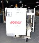 Used Jones Model CMV5 Semi-Automatic Tuck Vertical Cartoner. Machine is capable of speeds up to 120 cartons per minute. Has manual load station of 8' (both sides). Has 5