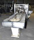 Used Jones Model CMV5 Semi-Automatic Tuck Vertical Cartoner. Machine is capable of speeds up to 120 cartons per minute. Has manual load station of 8' (both sides). Has 5