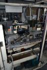 Used Jones Model CMV5 Semi-Automatic Tuck Vertical Cartoner. Machine is capable of speeds up to 120 cartons per minute. Has manual load station of 8' (both sides). Has 5