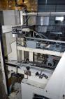 Used Jones Model CMV5 Semi-Automatic Tuck Vertical Cartoner. Machine is capable of speeds up to 120 cartons per minute. Has manual load station of 8' (both sides). Has 5