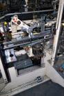 Used Jones Model CMV5 Semi-Automatic Tuck Vertical Cartoner. Machine is capable of speeds up to 120 cartons per minute. Has manual load station of 8' (both sides). Has 5