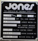 Used Jones Model CMV5 Semi-Automatic Tuck Vertical Cartoner. Machine is capable of speeds up to 120 cartons per minute. Has manual load station of 8' (both sides). Has 5