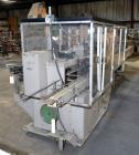 Used Jones Model CMV5 Semi-Automatic Tuck Vertical Cartoner. Machine is capable of speeds up to 120 cartons per minute. Has manual load station of 8' (both sides). Has 5
