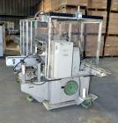 Used Jones Model CMV5 Semi-Automatic Tuck Vertical Cartoner. Machine is capable of speeds up to 120 cartons per minute. Has manual load station of 8' (both sides). Has 5