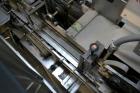 Used Jones Model CMV5 Semi-Automatic Tuck Vertical Cartoner. Machine is capable of speeds up to 120 cartons per minute. Has manual load station of 8' (both sides). Has 5