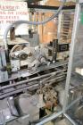 Used Jones Model CMV5 Semi-Automatic Tuck Vertical Cartoner. Machine is capable of speeds up to 120 cartons per minute. Has manual load station of 8' (both sides). Has 5