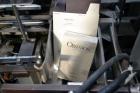 Used Jones Model CMV5 Semi-Automatic Tuck Vertical Cartoner. Machine is capable of speeds up to 120 cartons per minute. Has manual load station of 8' (both sides). Has 5