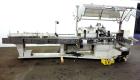 Used Jones Model CMV5 Semi-Automatic Tuck Vertical Cartoner. Machine is capable of speeds up to 120 cartons per minute. Has manual load station of 8' (both sides). Has 5