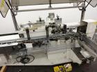 Used Jones Model CMV5 Semi-Automatic Tuck Vertical Cartoner. Machine is capable of speeds up to 120 cartons per minute. Has manual load station of 8' (both sides). Has 5