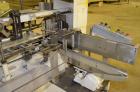 Used Jones Model CMV5 Semi-Automatic Tuck Vertical Cartoner. Machine is capable of speeds up to 120 cartons per minute. Has manual load station of 8' (both sides). Has 5