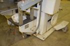 Used Jones Model CMV5 Semi-Automatic Tuck Vertical Cartoner. Machine is capable of speeds up to 120 cartons per minute. Has manual load station of 8' (both sides). Has 5