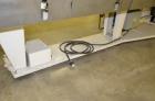 Used Jones Model CMV5 Semi-Automatic Tuck Vertical Cartoner. Machine is capable of speeds up to 120 cartons per minute. Has manual load station of 8' (both sides). Has 5