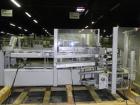 Used Kodiak Tanney Model 601-120 Vertical Cartoner. Capable of speeds up to 120 cartons per minute. Has rotary carton feed, has 9