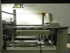 Used Kodiak Tanney Model 601-120 Vertical Cartoner. Capable of speeds up to 120 cartons per minute. Has rotary carton feed, has 9