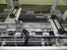 Used Kodiak Tanney Model 601-120 Vertical Cartoner. Capable of speeds up to 120 cartons per minute. Has rotary carton feed, has 9