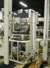 Used Kodiak Tanney Model 601-120 Vertical Cartoner. Capable of speeds up to 120 cartons per minute. Has rotary carton feed, has 9