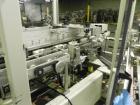 Used Kodiak Tanney Model 601-120 Vertical Cartoner. Capable of speeds up to 120 cartons per minute. Has rotary carton feed, has 9