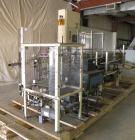 Used Paxall Clybourn Semi Automatic Vertical Hot Melt Cartoner, Model CHL-A. Capable of speeds up to 120 cpm. Has 6' long powered carton magazine with rotary carton feeder. Currently set up on 5