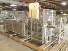 Used Paxall Clybourn Semi Automatic Vertical Hot Melt Cartoner, Model CHL-A. Capable of speeds up to 120 cpm. Has 6' long powered carton magazine with rotary carton feeder. Currently set up on 5