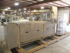 Used Paxall Clybourn Semi Automatic Vertical Hot Melt Cartoner, Model CHL-A. Capable of speeds up to 120 cpm. Has 6' long powered carton magazine with rotary carton feeder. Currently set up on 5