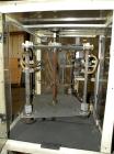Used Paxall Clybourn Semi Automatic Vertical Hot Melt Cartoner, Model CHL-A. Capable of speeds up to 120 cpm. Has 6' long powered carton magazine with rotary carton feeder. Currently set up on 5