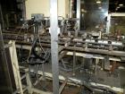 Used Paxall Clybourn Semi Automatic Vertical Hot Melt Cartoner, Model CHL-A. Capable of speeds up to 120 cpm. Has 6' long powered carton magazine with rotary carton feeder. Currently set up on 5