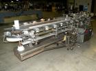 Used Tisma Intermittent Motion Vertical Hot Melt Cartoner, Model TC-50-E. Capable of speeds up to 60 CPM. Has 10
