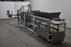 Used Clybourn CHL Vertical Hand Load Hot Melt Glue Cartoner. Capable of speeds from 10 to 100 cartoners per minute. Set on 10