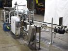 Used Clybourn CHL Vertical Hand Load Hot Melt Glue Cartoner. Capable of speeds from 10 to 100 cartoners per minute. Set on 10
