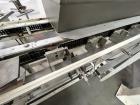 Used Clybourn CHL Vertical Hand Load Hot Melt Glue Cartoner. Capable of speeds from 10 to 100 cartoners per minute. Set on 10