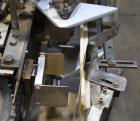 Used Clybourn CHL Vertical Hand Load Hot Melt Glue Cartoner. Capable of speeds from 10 to 100 cartoners per minute. Set on 10