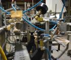 Used Clybourn CHL Vertical Hand Load Hot Melt Glue Cartoner. Capable of speeds from 10 to 100 cartoners per minute. Set on 10