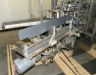 Used Tisma Vertical Cartoner, Model TC-50E. Capable of speeds to 200 cartons per minute. Currently set up with 2
